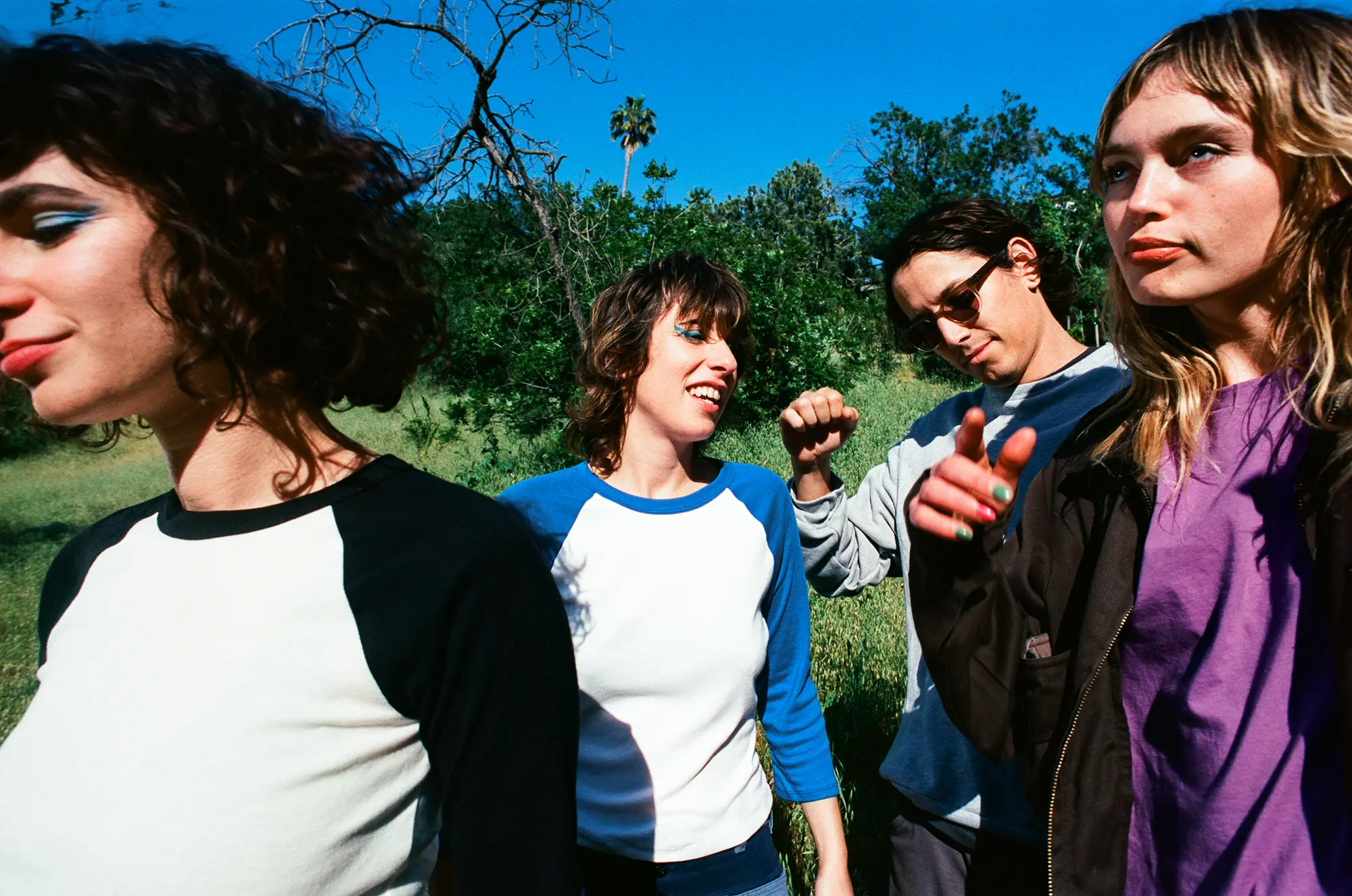 beige fabric being stretched over a machine during the coloring process in a factory