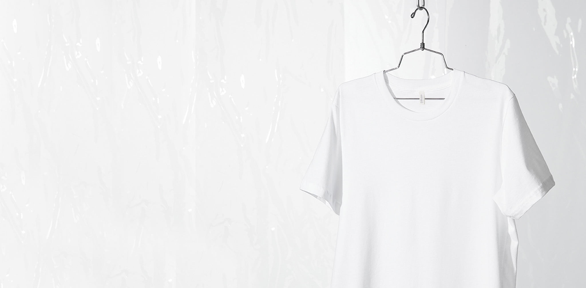 white tee hanging on wire hanger