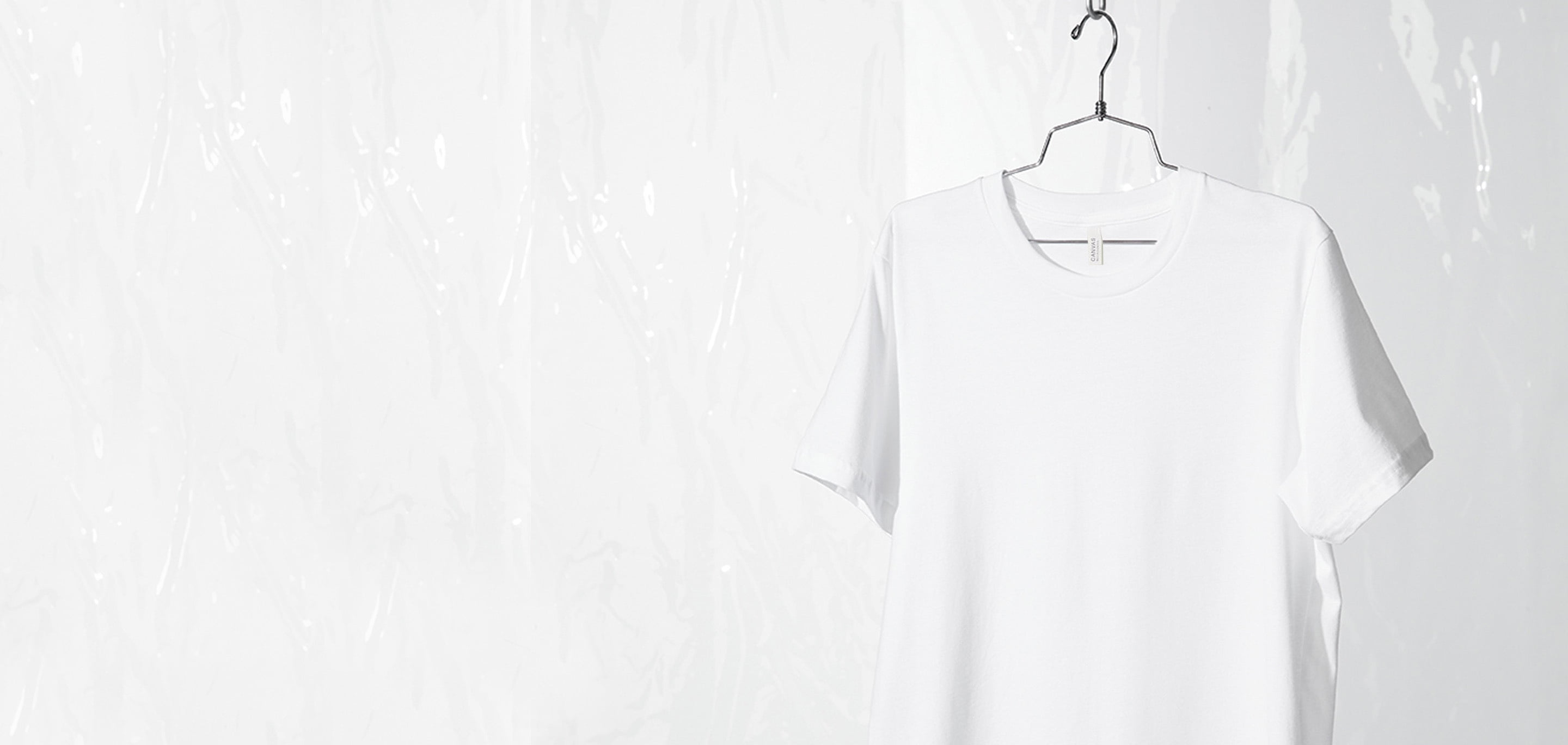 white tee hanging on wire hanger