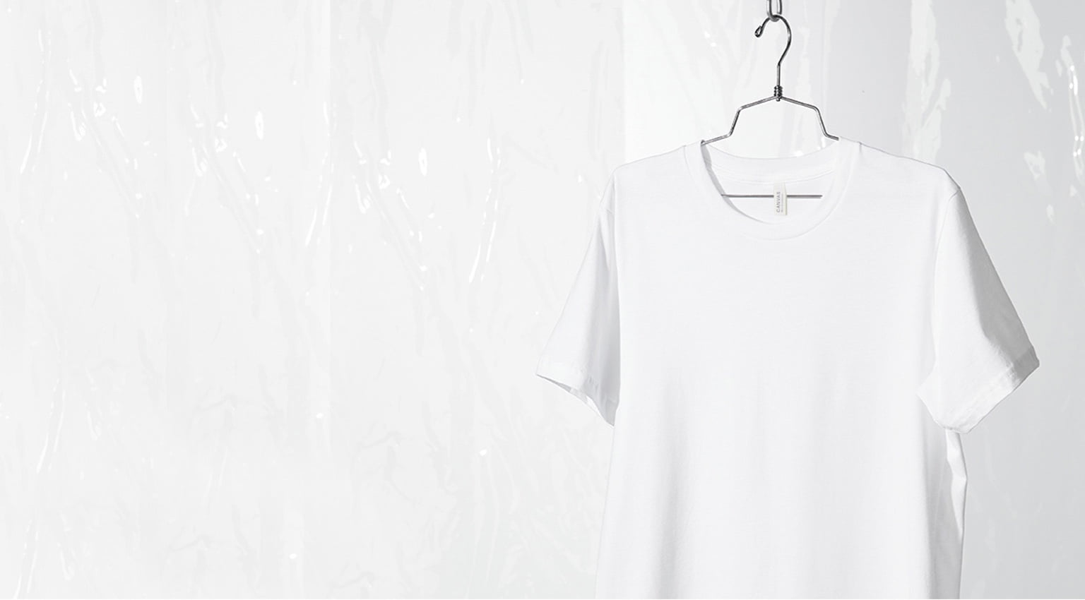 white tee hanging on wire hanger